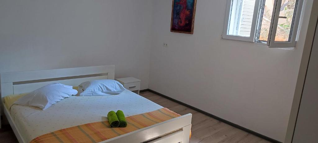 Postel nebo postele na pokoji v ubytování Apartments Ivan