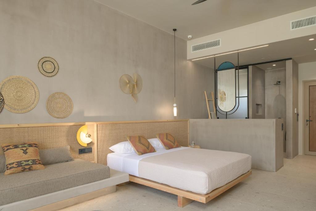 Posteľ alebo postele v izbe v ubytovaní NERĒA Boutique Hotel