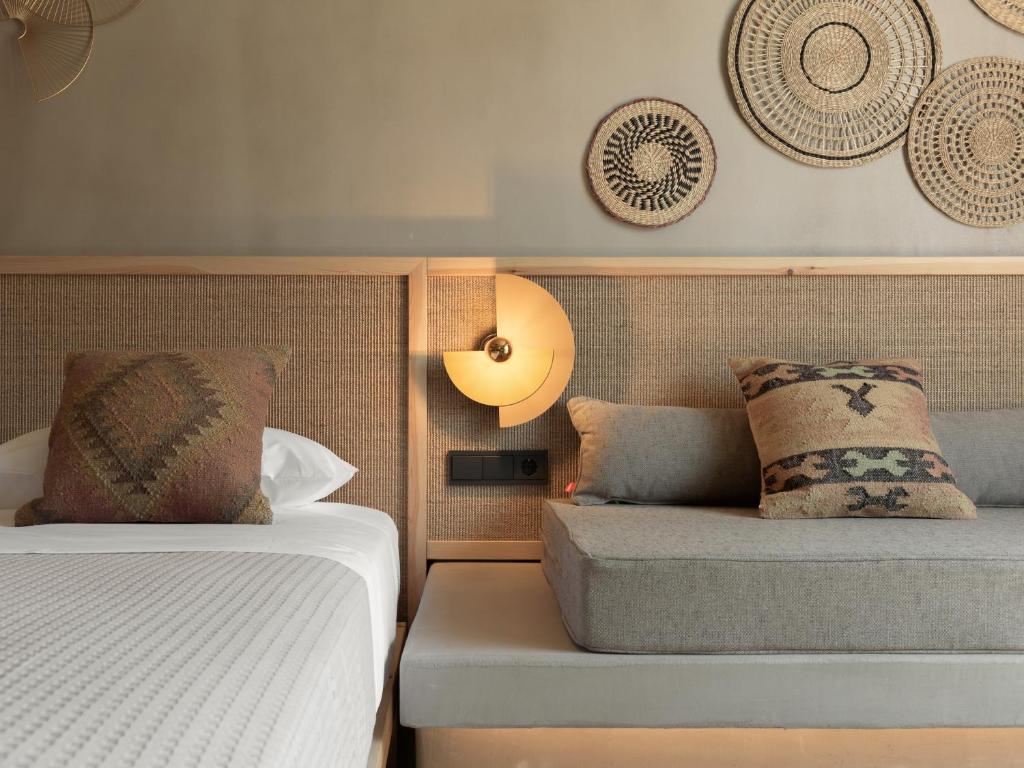 Posteľ alebo postele v izbe v ubytovaní NERĒA Boutique Hotel