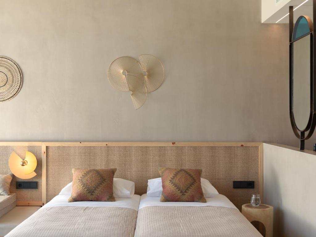 Posteľ alebo postele v izbe v ubytovaní NERĒA Boutique Hotel