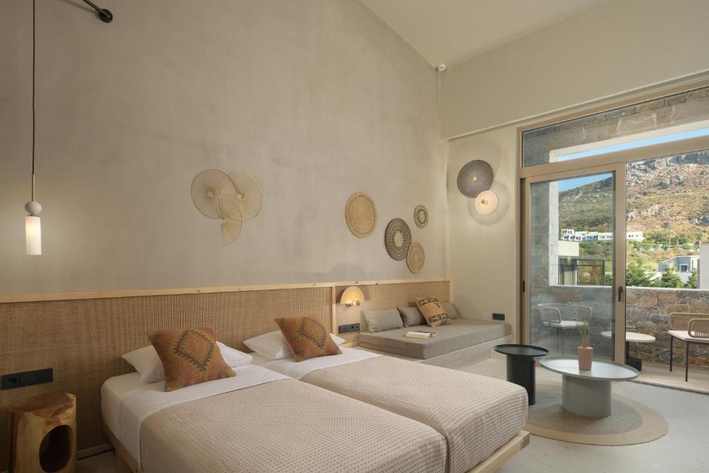 Posteľ alebo postele v izbe v ubytovaní NERĒA Boutique Hotel