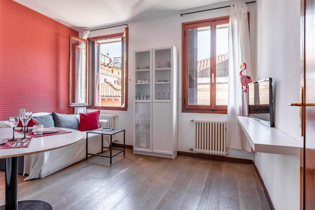 a living room with a couch and a table at [VENEZIA-SAN MARCO] VIEW ON LUXURY SHOPPING STREET in Venice