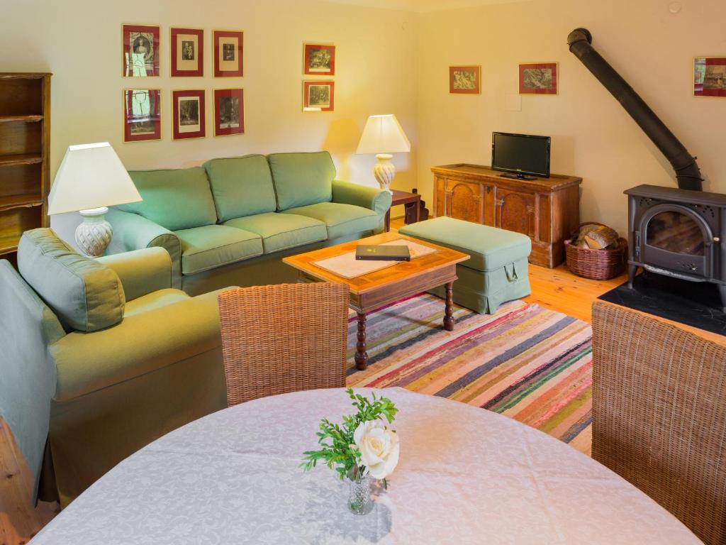 a living room with a couch and a table at Laffelberghaus in Steinakirchen am Forst