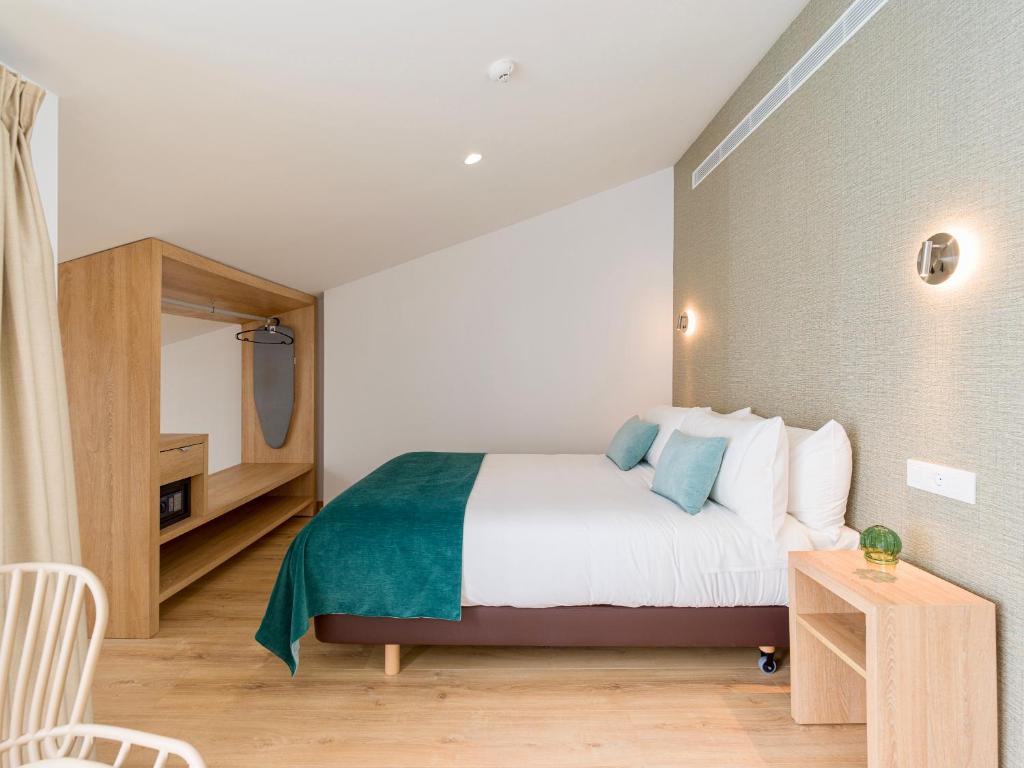 Postel nebo postele na pokoji v ubytování Hotel Emeté & Coworking by airnest