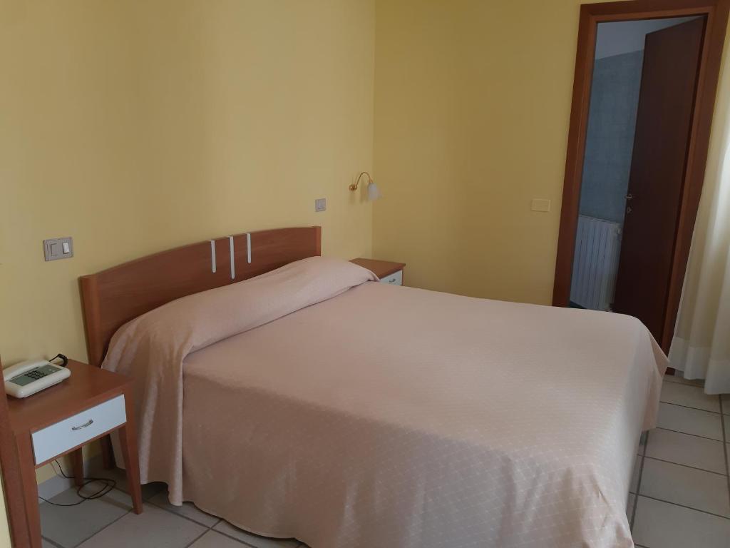 Postel nebo postele na pokoji v ubytování Hotel Brufa