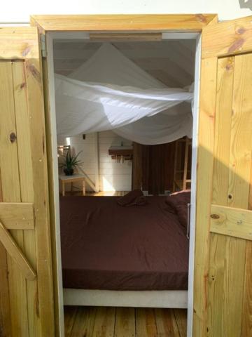 Postel nebo postele na pokoji v ubytování Akunamatata Guest House Cul de Sac