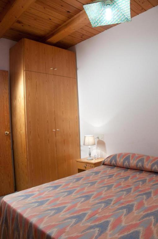 Posteľ alebo postele v izbe v ubytovaní Apartamentos Siglo XXI - Ancla