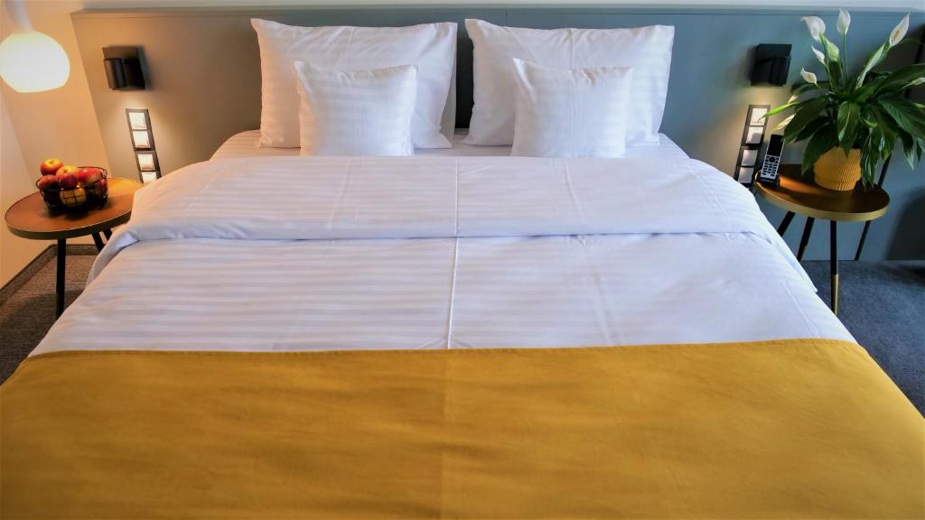 Postel nebo postele na pokoji v ubytování WERK Hotel & SPA