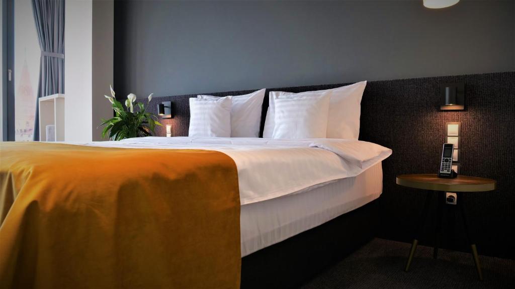 Postel nebo postele na pokoji v ubytování WERK Hotel & SPA