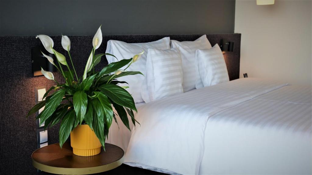 Postel nebo postele na pokoji v ubytování WERK Hotel & SPA