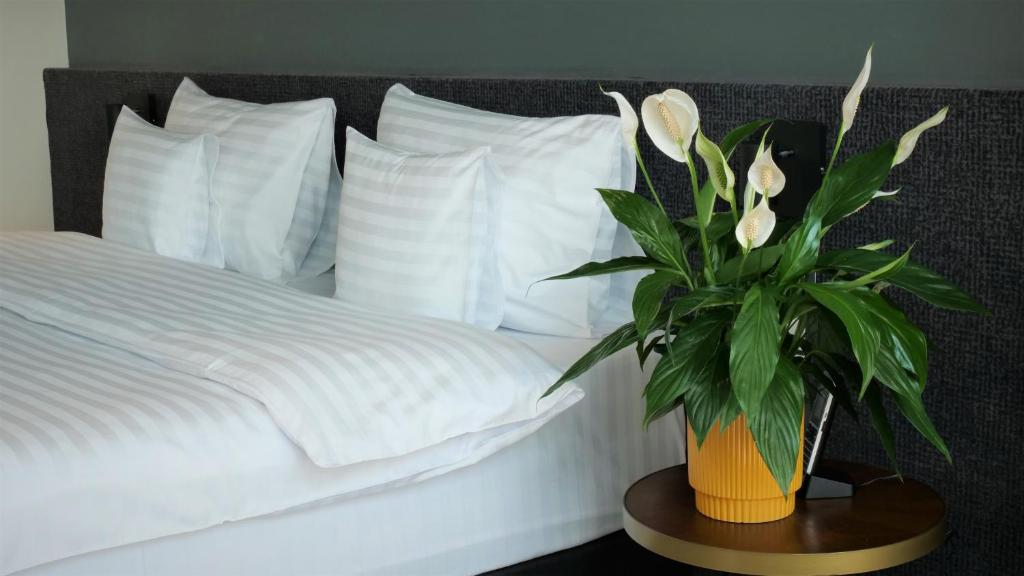 Postel nebo postele na pokoji v ubytování WERK Hotel & SPA