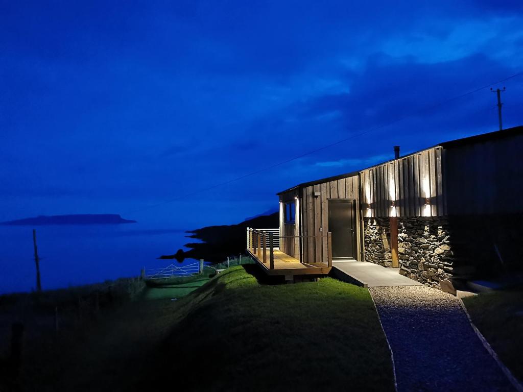 a building with a door on the side of it at Byre 7 Aird of Sleat in Aird of Sleat