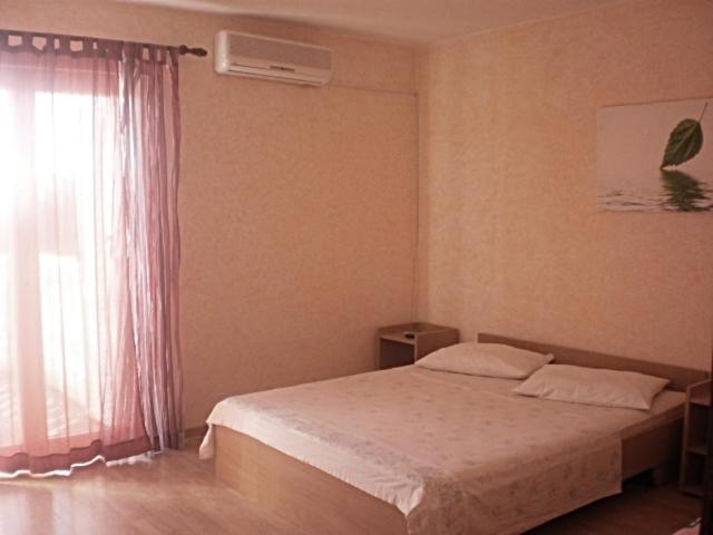 Postel nebo postele na pokoji v ubytování Apartments & Rooms Tony