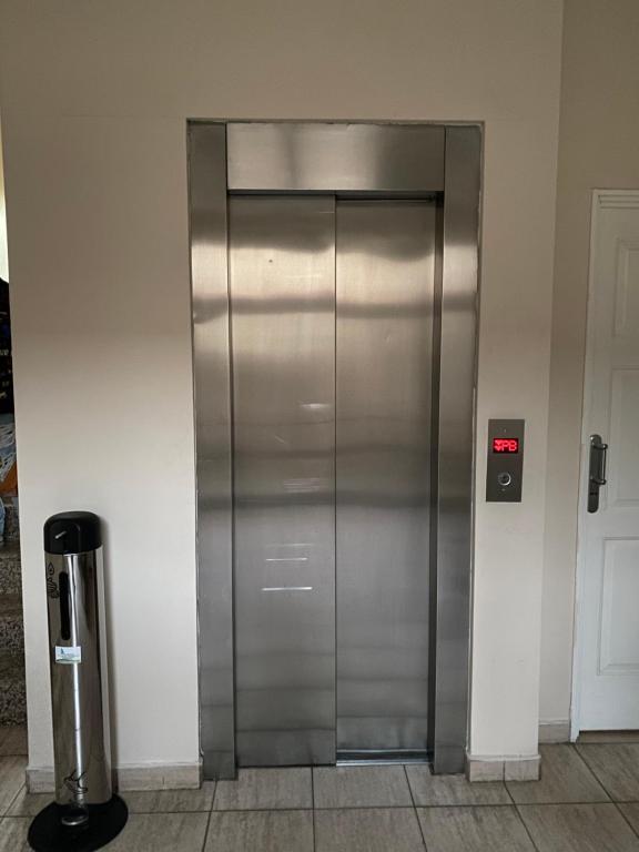 a stainless steel elevator in a building at Complejo Las Moras in Santa Rosa