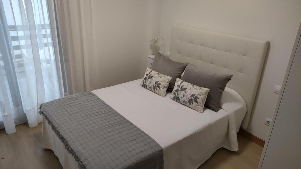 Postel nebo postele na pokoji v ubytování Apartamentos Boutique Arquera Golf I
