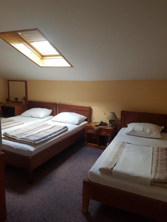 Postel nebo postele na pokoji v ubytování Ada Apartments