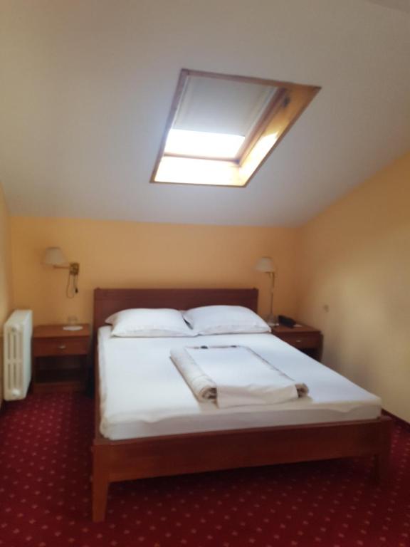 Postel nebo postele na pokoji v ubytování Ada Apartments