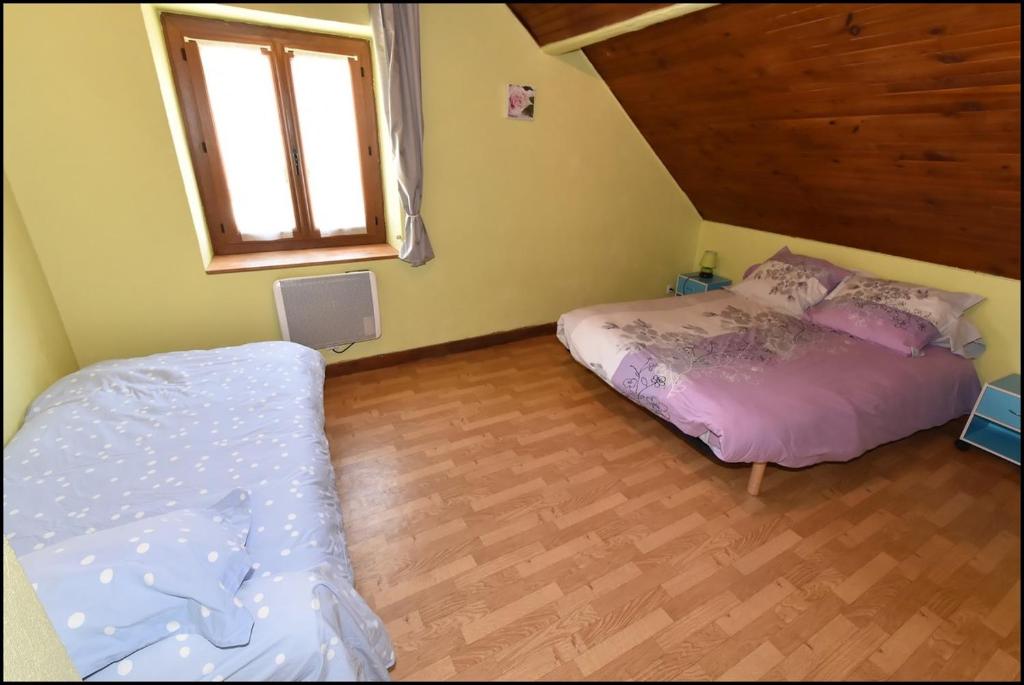 Postel nebo postele na pokoji v ubytování Doudou Vercors