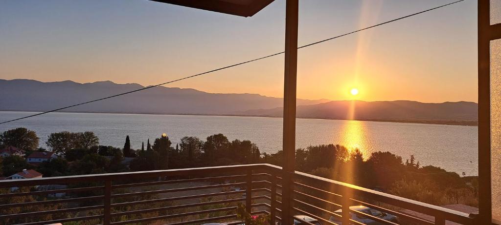 a view of a sunset from the balcony of a house at Apartmani Pavlovi Star Dojran in Star Dojran