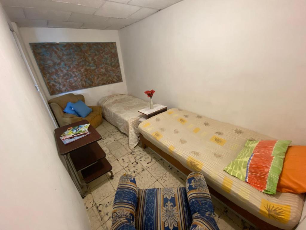 Postel nebo postele na pokoji v ubytování Hostal Casa Las Tías