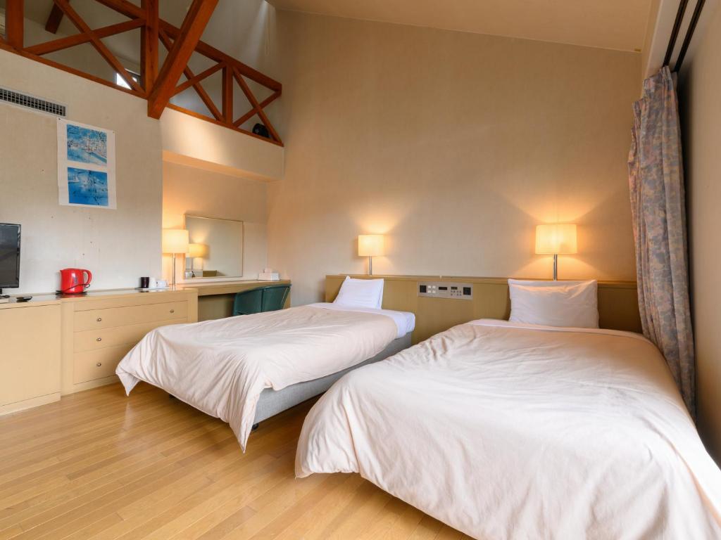 Postel nebo postele na pokoji v ubytování Tabist Villa Daio Resort Ise-Shima