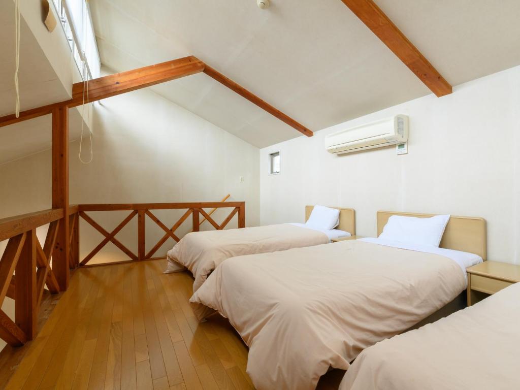 Postel nebo postele na pokoji v ubytování Tabist Villa Daio Resort Ise-Shima