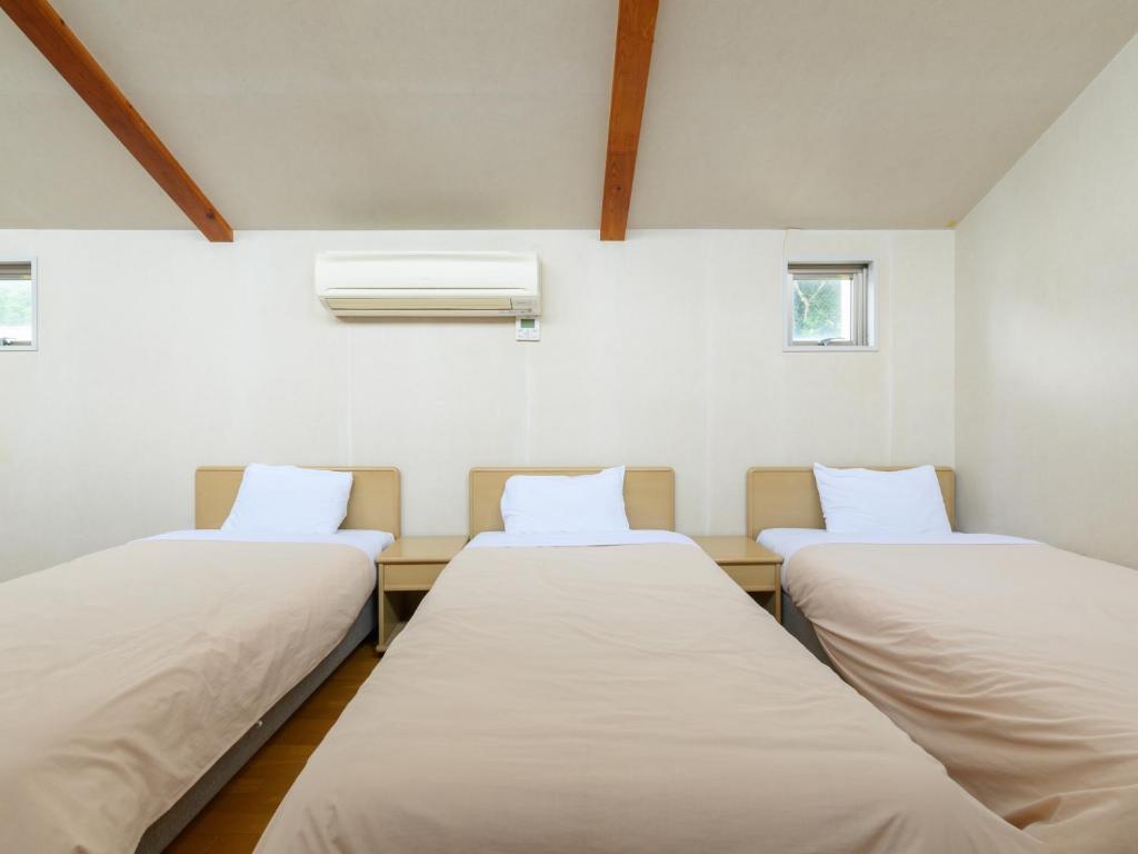 Postel nebo postele na pokoji v ubytování Tabist Villa Daio Resort Ise-Shima