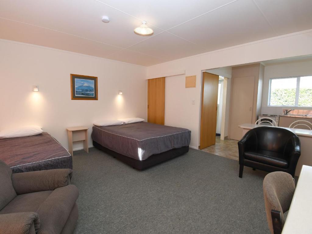 Postel nebo postele na pokoji v ubytování Avon Motel
