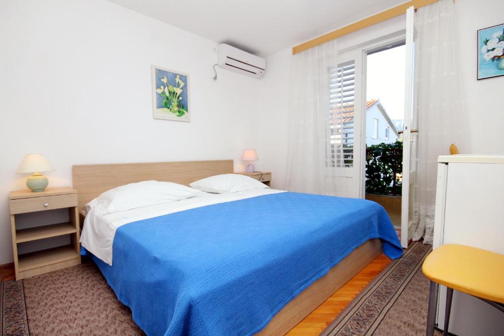 Posteľ alebo postele v izbe v ubytovaní Apartments and rooms by the sea Vrboska (Hvar) - 540