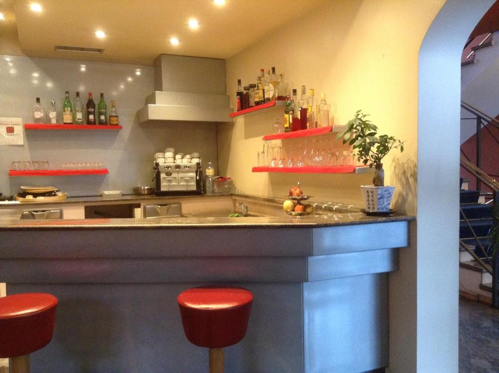 Kuchyň nebo kuchyňský kout v ubytování Hotel Maxim