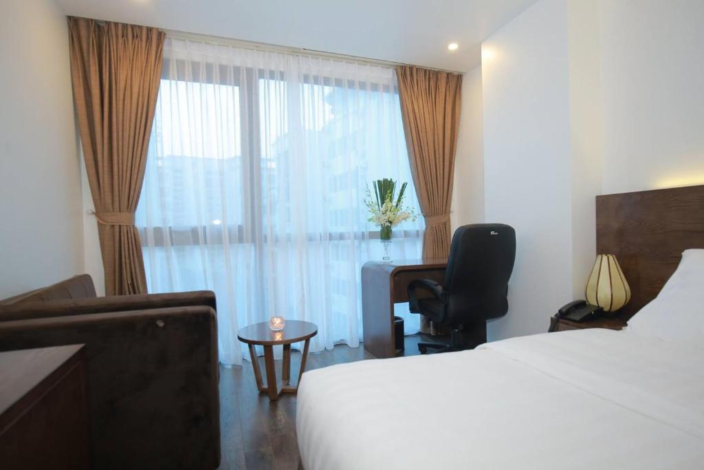 Postel nebo postele na pokoji v ubytování Inearth Hotel