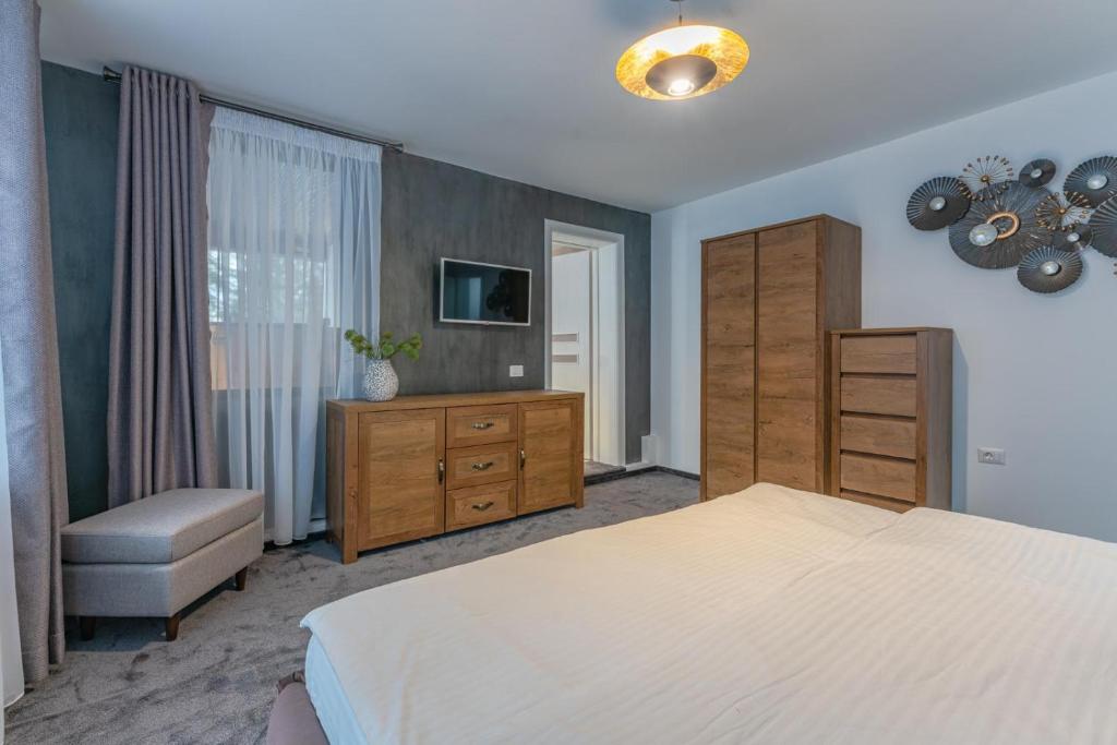 Postel nebo postele na pokoji v ubytování Iris Predeal