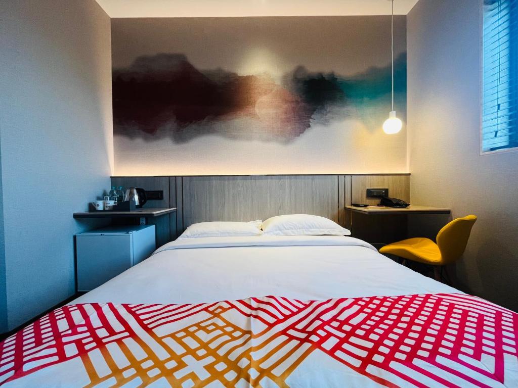 Postel nebo postele na pokoji v ubytování Ginger Mumbai, Goregaon