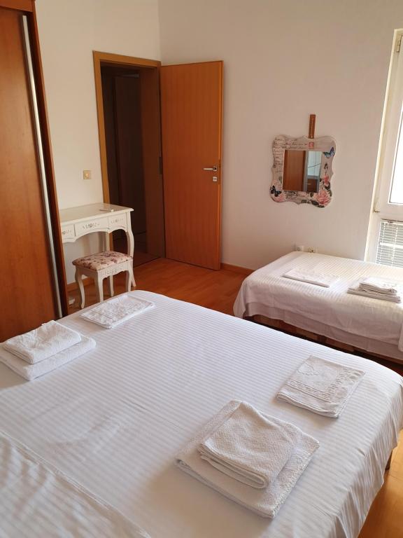Postel nebo postele na pokoji v ubytování Villa Olive Garden