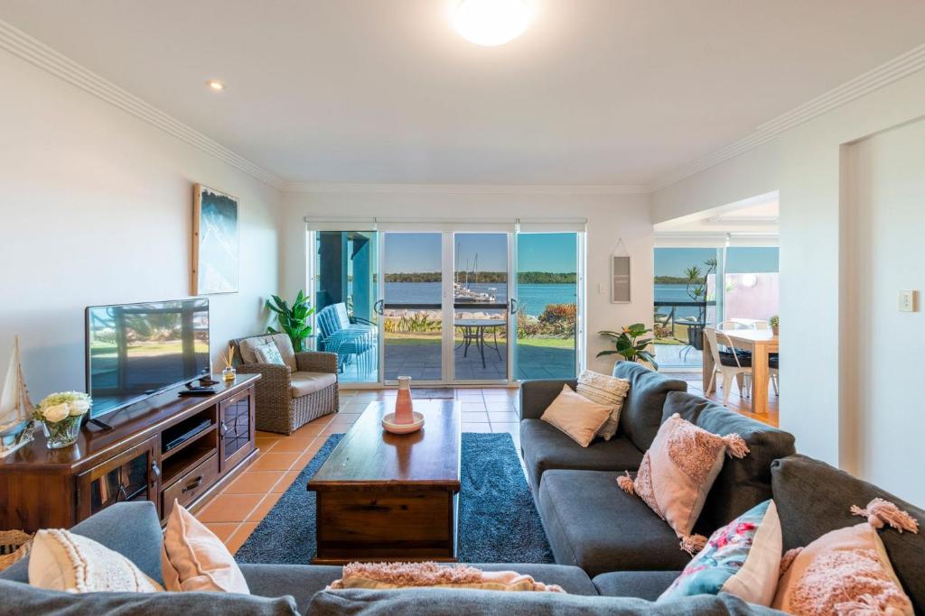 a living room with two couches and a television at Riverview Apartments 2 3 Building 2 Unit 3 in Iluka