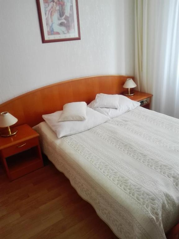 Postel nebo postele na pokoji v ubytování Geovita Dąbki