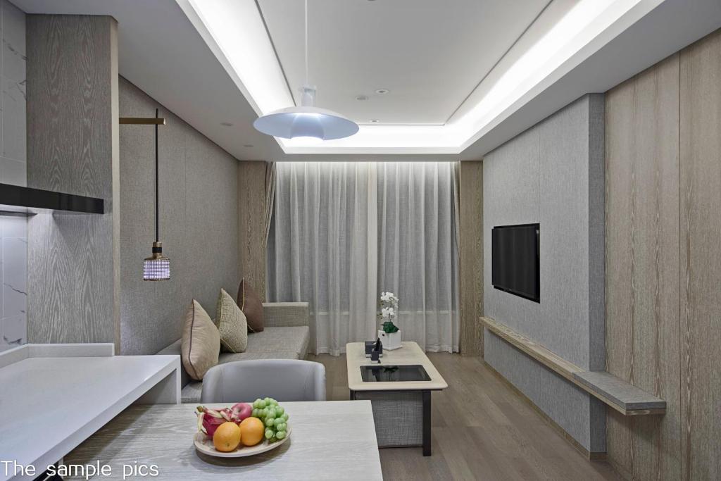 TV a/nebo společenská místnost v ubytování Shenzhen FY Hotel