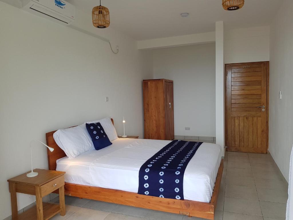Postel nebo postele na pokoji v ubytování Bougainvillas Seychelles