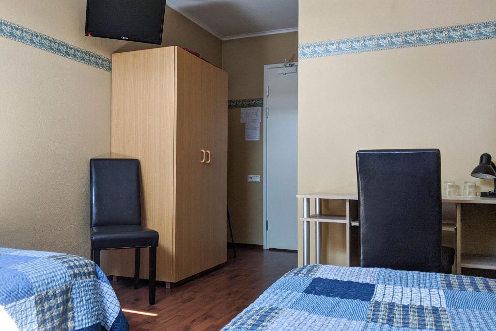 Postel nebo postele na pokoji v ubytování Kapten Krantz Guesthouse