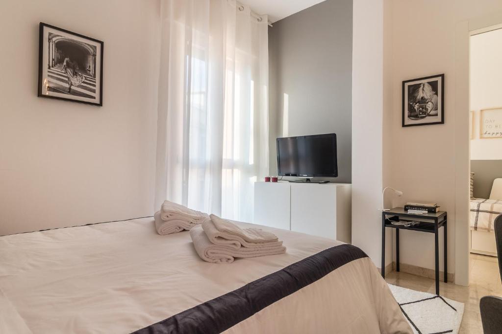 Posteľ alebo postele v izbe v ubytovaní Grey House in the heart of @Treviso