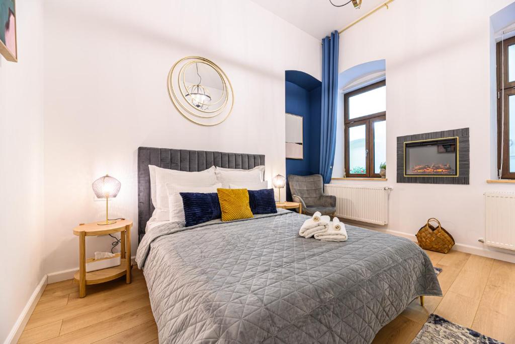 a bedroom with a bed with a dog laying on it at Uptown 46 in Braşov