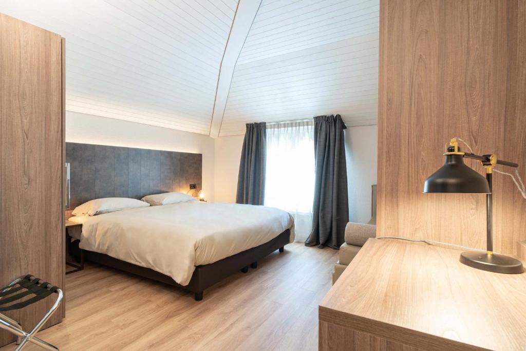 Postel nebo postele na pokoji v ubytování Relais Lucomagno