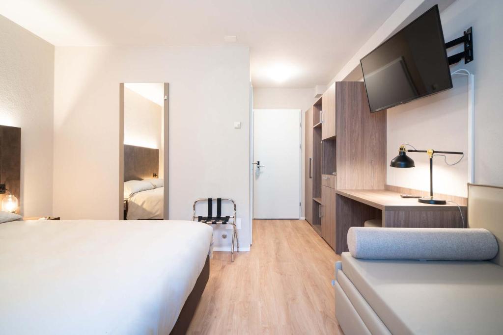 Postel nebo postele na pokoji v ubytování Relais Lucomagno
