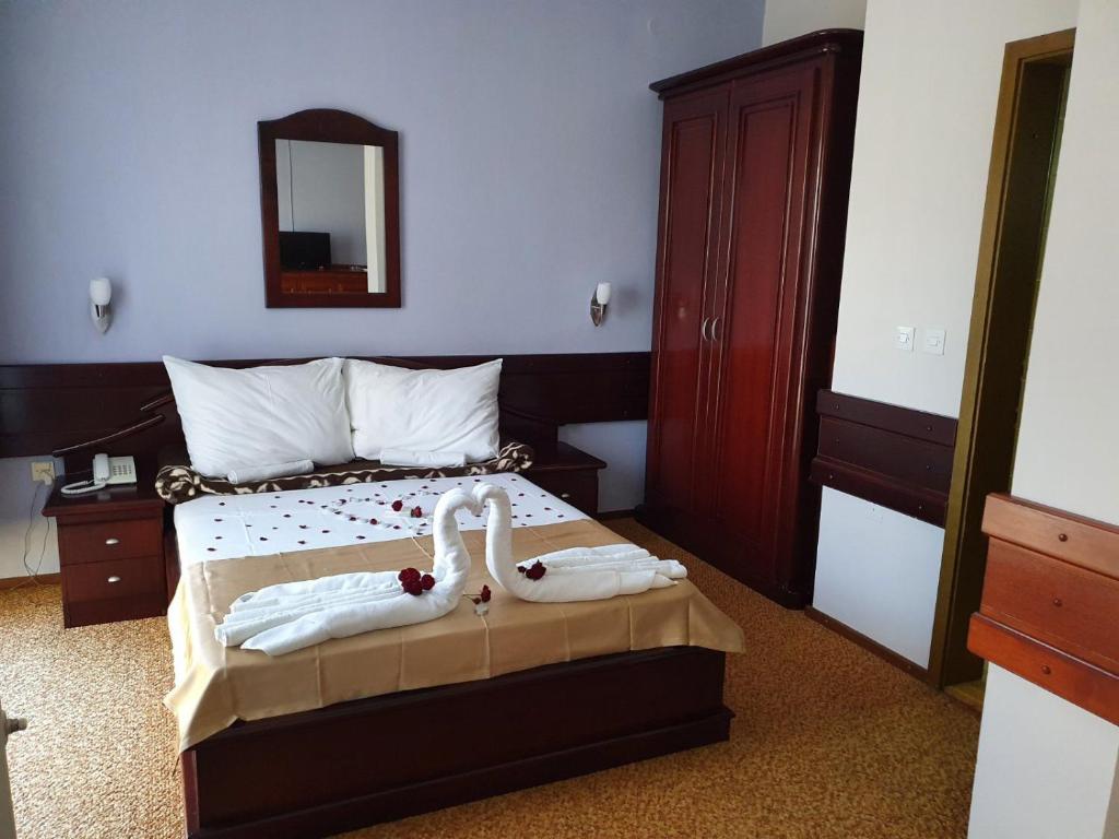 Postel nebo postele na pokoji v ubytování Hotel Biser Panonija