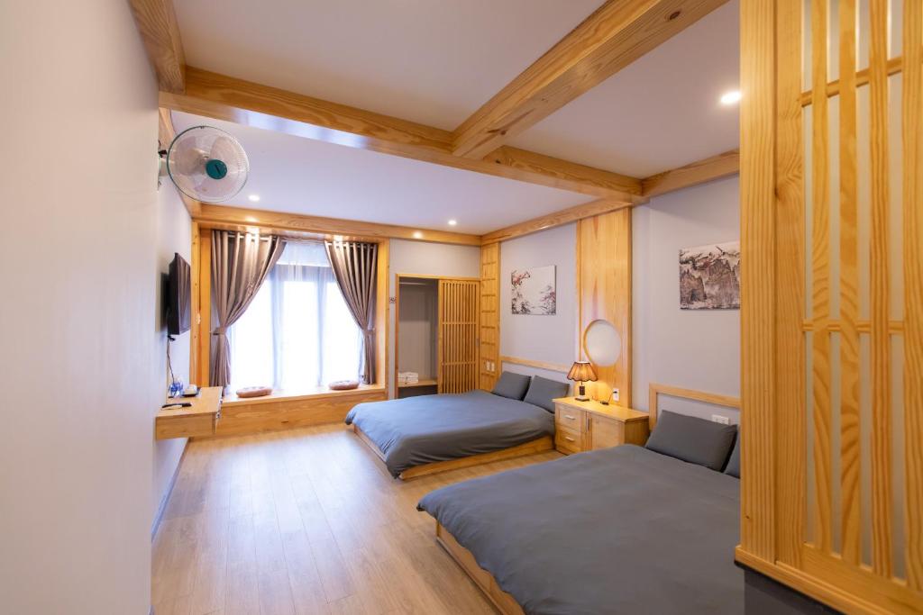 Giường trong phòng chung tại Nguyễn Tài Hostel &amp; Coffee Đà Lạt