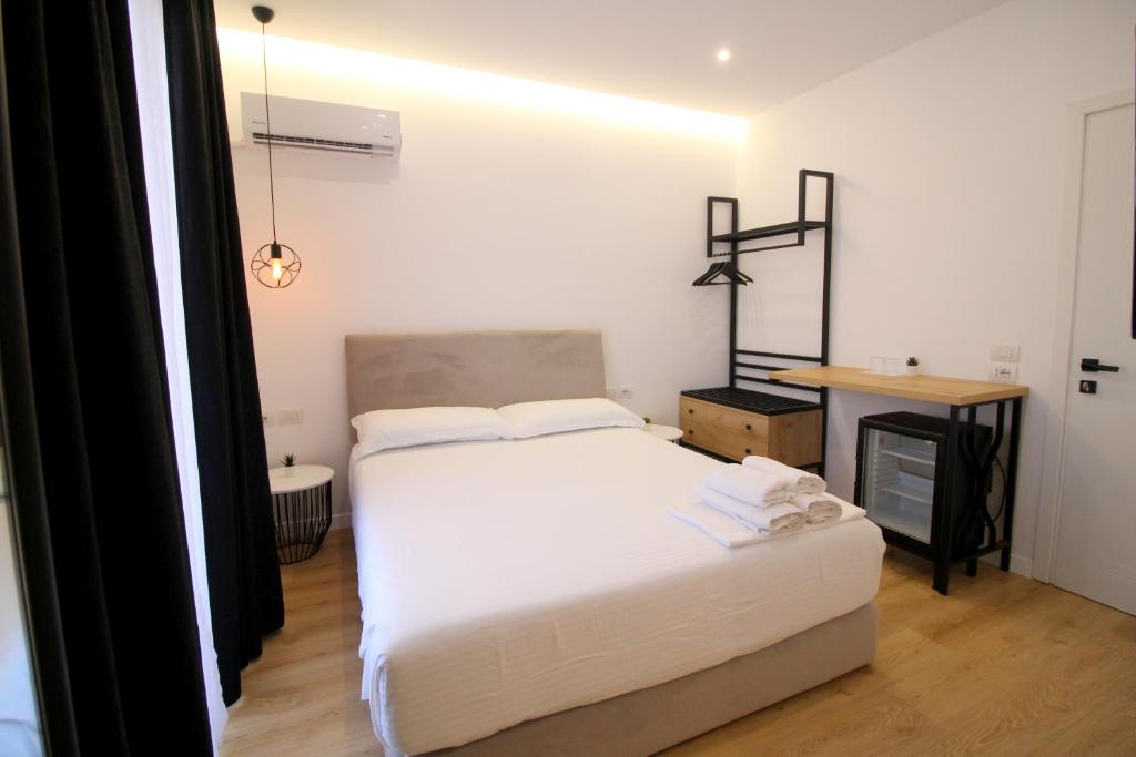 Postel nebo postele na pokoji v ubytování Hotel Qurku 2