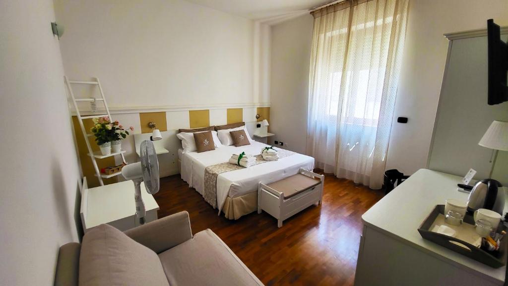 Postel nebo postele na pokoji v ubytování Attico Barocco