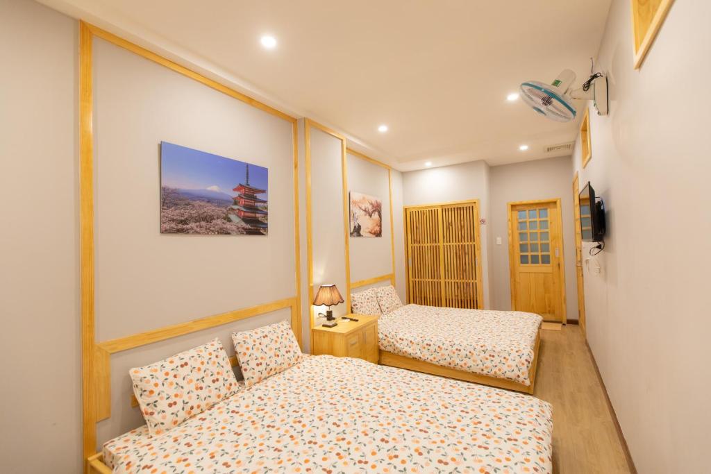 Giường trong phòng chung tại Nguyễn Tài Hostel &amp; Coffee Đà Lạt