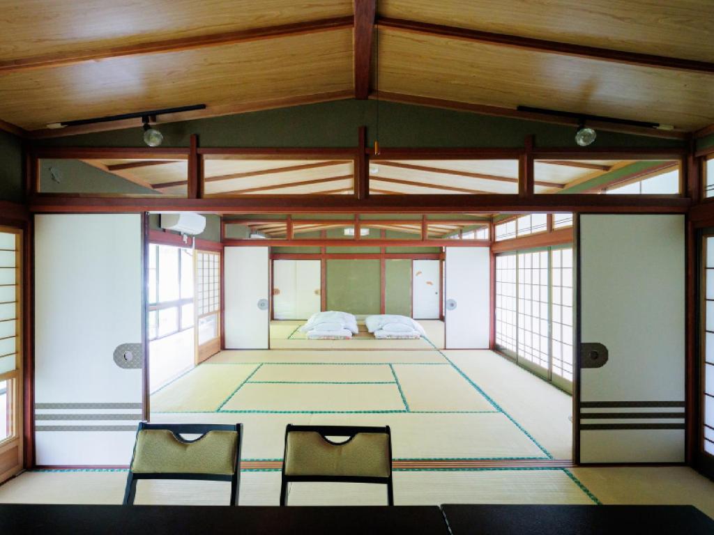 Postel nebo postele na pokoji v ubytování Ryokan Kigusuriya