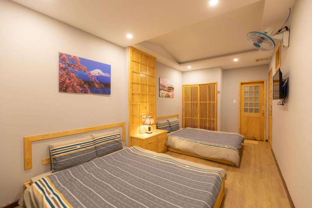 Giường trong phòng chung tại Nguyễn Tài Hostel &amp; Coffee Đà Lạt